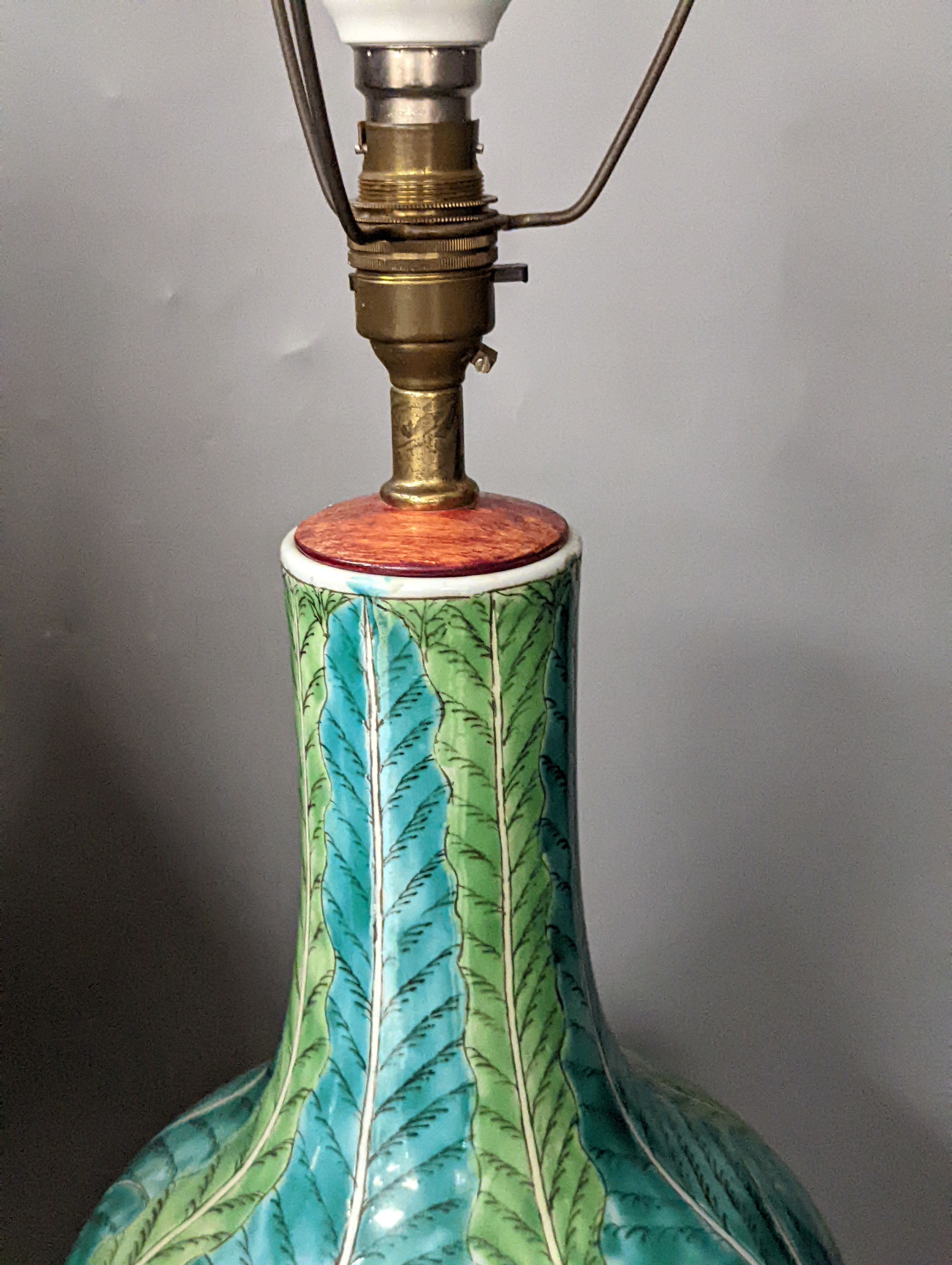 A Japanese gilt lacquered and turquoise glazed ’dragon’ vase on stand, and a Chinese cabbage patterned table lamp, Dragon vase and stand 65 cms high.